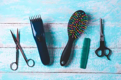 Image of hair cutting equipment over blue background