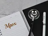 Mpox written on notepad with stethoscope