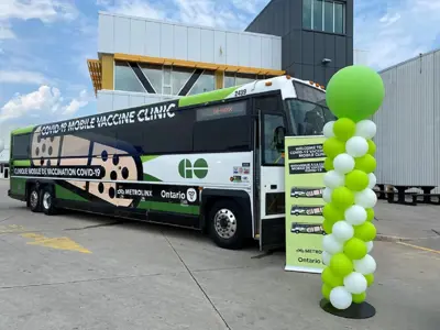 Covid 19 Vaccine Bus parked in front of building