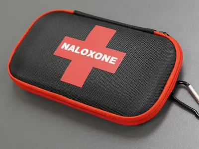 Closed naloxone kit sitting on a table