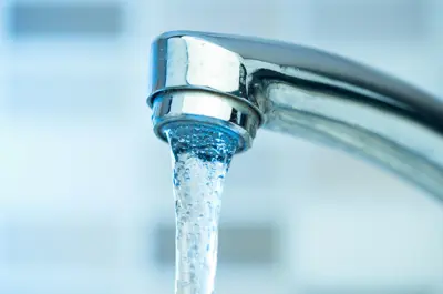 Water coming out of a tap