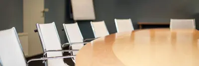 Empty boardroom with table and chairs