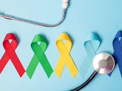 Colourful awareness ribbons resting on table